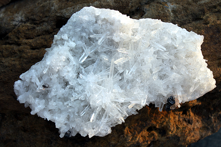 small crystals (silver) of H bnerite in a matrix of quartz